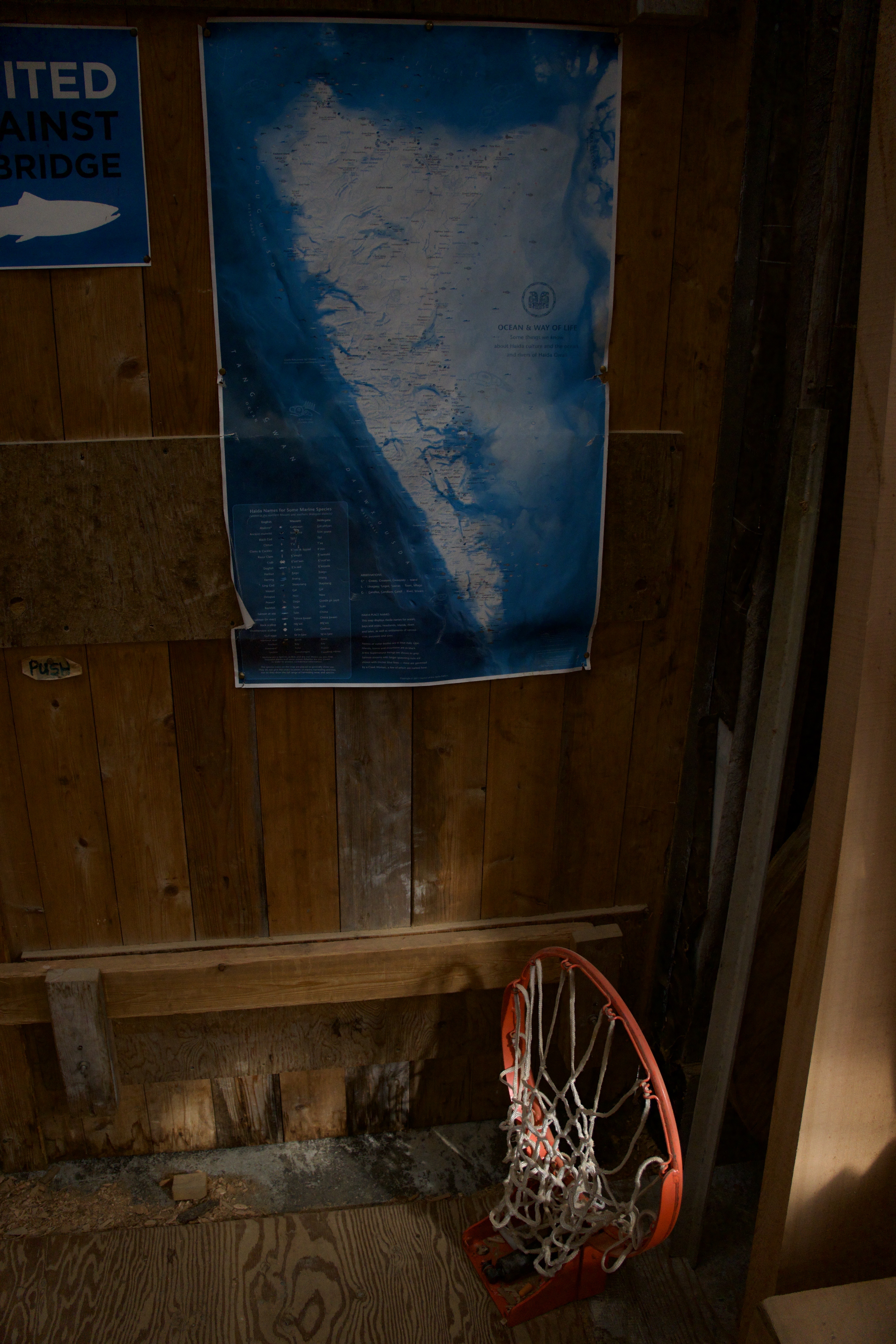 A basketball hoop leaning against a wall